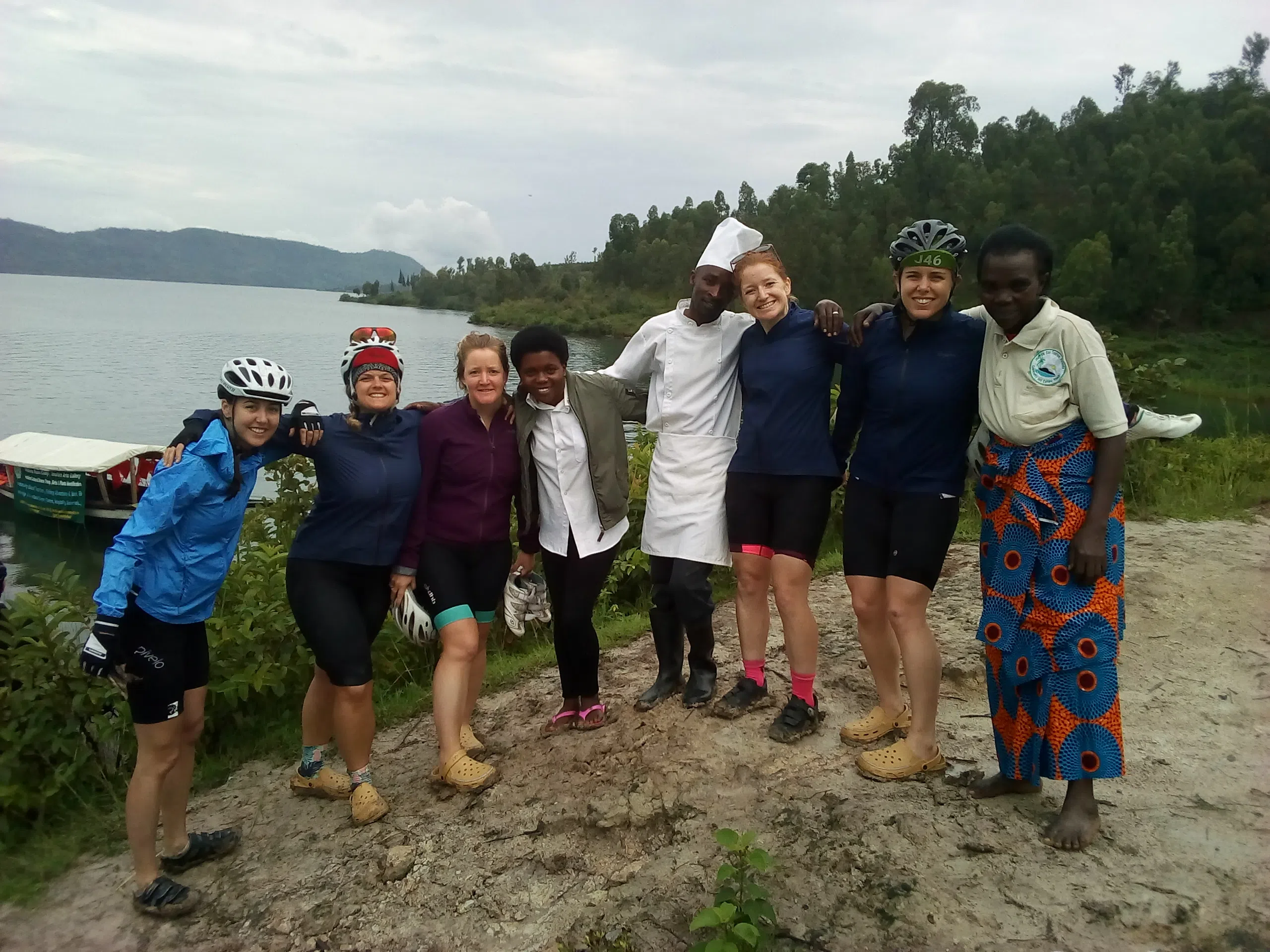 a group of clients and rwandan guide hiking